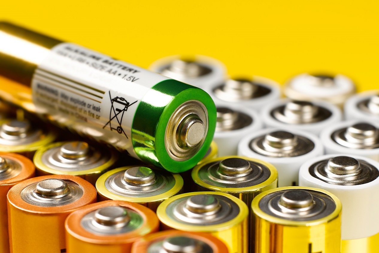 Closeup of AA battery on group of AA batteries