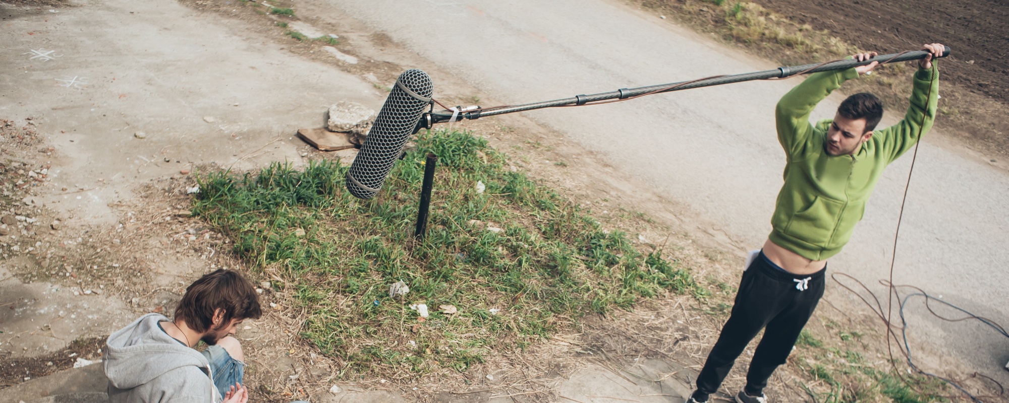 Location sound recordist recording exterior audio